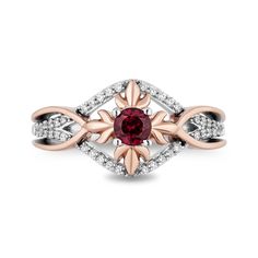 a red and white diamond ring with an intricate design