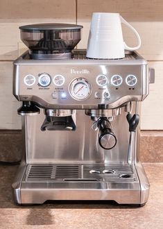 an espresso machine sitting on top of a counter