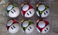 six decorated christmas balls in a plastic box