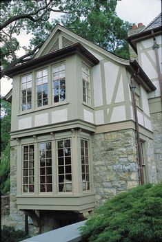 an old house with stone and wood trim