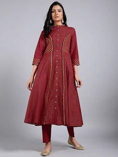 A red princess line kali kurta with 3/4th sleeves, hand block printed in gold, and details in gota. Features: Front open jacket dress with 3/4th sleeves Shell - pure cotton fabric Block printed in gold Side kali flare from waist to hem Handmade in India Measurements: Size XS : Bust-34", Waist-29", Hip-Flared, Shoulder-13", Length-47", Sleeve length-17" Size S : Bust-36", Waist-31", Hip-Flared, Shoulder-13.5", Length-47", Sleeve length- 17" Size M : Bust-38", Waist-33", Hip-Flared, Shoulder-14", Kali Dress, Red Princess, Princess Line, Simple Kurta Designs, Boutique Suits, Open Jacket, Cotton Kurta, Comfort Wear, Kurta Designs