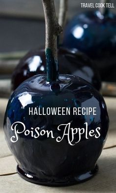 two black apples with the words halloween recipe written in white on them, sitting next to each other