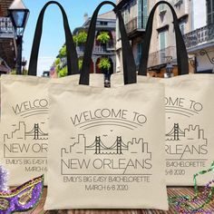 three bags with the words welcome to new orleans and bay bridge in black on them