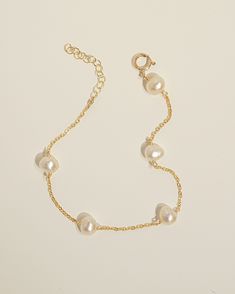 Product Details White irregular Pearl. Bracelet length is adjustable from 6 to 7 inches. Safe for sensitive skin. Available in 14k Gold Filled or Sterling Silver. Adjustable 14k Gold-filled Bracelet, Adjustable 14k Gold Filled Bracelet, Elegant Resizable Pearl Bracelet, Elegant Resizable Bracelet For Formal Occasions, Adjustable Classic Gold Oyster Bracelet, Classic Adjustable Gold Oyster Bracelet, Classic Adjustable Hypoallergenic Gold Bracelet, Elegant Adjustable Hypoallergenic Jewelry, Elegant 14k Gold-filled Bracelet With Extender