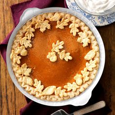 an overhead view of a pie with walnuts in it on a wooden table top