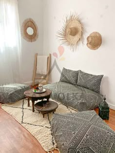 a living room with two couches and a coffee table in front of a window