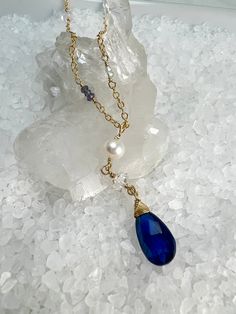 Looking for something unique for that Kyanite Lover? Do you love Herkimer Diamonds? This is a beautiful design that incorporates both, with accents of faceted Blue Topaz, Iolite & Blue Quartz.Gorgeous 9 X 15mm Blue Kyanite pendant is hand wrapped to a Herkimer Diamond & Beautiful Freshwater Pearl for a stunning drop pendant. The Kyanite gemstone has striations and shades of blue, and with the faceting, make this pendant stunning!The chain is comprised of stations of beautiful Herkimer Diamonds, Blue Briolette Necklace For Wedding, Tanzanite Briolette Gemstone Necklace, Tanzanite Briolette Necklace Gift, Briolette Tanzanite Necklace For Gift, Blue Topaz Briolette Jewelry Gift, Blue Topaz Briolette Jewelry For Gifts, Briolette Blue Topaz For Jewelry Making, Blue Briolette Necklace For Anniversary, Tanzanite Faceted Necklace For Gift