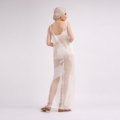 Semi-transparent macrame dress with round neckline and wide straps. Dry clean only. Sheer Lace Beachwear Dresses, Elegant Open Knit Crochet Dress For Summer, Elegant Open Knit Summer Dresses, Spring Beach Dress With Sheer Back, Sheer Mesh Maxi Dress For Beach, Elegant Sheer Mesh Dress For Beach, Elegant Mesh Dress For Beach, Elegant Summer Mesh Dress For Beach, Elegant Summer Beach Mesh Dress