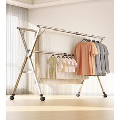 an ironing board with clothes hanging on it