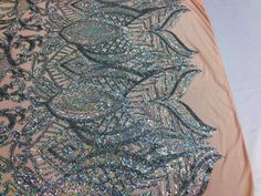 The sequins has especial and extraordinary design on the Mesh . It is super elegant and classy, The royalty design is embroidered with sequins on a mesh and can be used for dresses, tablecloths, backdrops, night gowns, skirts, prom dresses, wedding dresses, runners for tables, decorations and much more. Dear costumers: Please feel free to ask us, how much we have in stock on any item you want to purchase, do to the high volume of item in my store I don't put too much on my quantity box, but I do Royalty Design, Tables Decorations, Night Gowns, Stretch Mesh Fabric, Fabric Roses, Gala Dresses, Sequin Fabric, 4 Way Stretch Fabric, Mesh Design