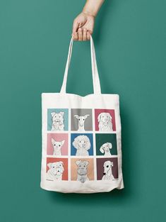 The two images show a tote bag being held at the top of the frame and hanging down into the centre.  The first image is on a teal background, the second on an orange background. There are nine different dog illustrations on each side of the bag; each dog is drawn in black and white set against a square of a different bright colour. Bright Bag, Dog Tote Bag, Painted Tote, Dog Tote, Cats Tote Bag, Dog Branding, Cat Tote, Dog Bag