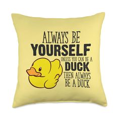 a yellow pillow that says always be yourself unless you can be a duck then always be a duck