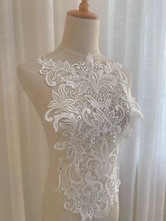 Color: Off White, Black Usage: lace wedding dress applique , bridal headdress,lace collar, lace patch ,Decorative wedding shoes Ideal for Dress, headbware, female underware brim,handbag accessory, hat. pillow,curtain,dolls outfits , home decor etc. My store links： https://www.etsy.com/shop/FionaLace?ref=simple-shop-header-name&listing_id=919538968 Similar product links: https://www.etsy.com/shop/FionaLace?ref=simple-shop-header-name&listing_id=919538968&section_id=32034550 Lace trim Elegant White Lace Bodice, White Lace Trim Wedding Bodice, White Lace Trim Bodice For Wedding, White Lace Bodice With Lace Trim, Wedding Bodice With Lace Trim, Lace Top With Lace Work For Wedding, White Lace Top With Lace Patchwork For Wedding, White Lace Patchwork Top For Wedding, Elegant Fitted Lace With Appliques