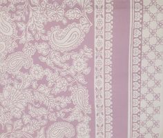 a purple and white paisley print fabric with vertical stripeing on the bottom half of it