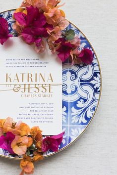 a plate with some flowers on it and a card in the middle that says kahrina