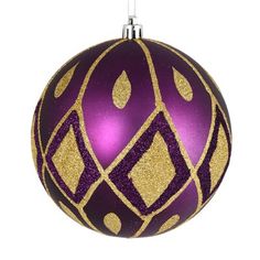 a purple and gold christmas ball ornament