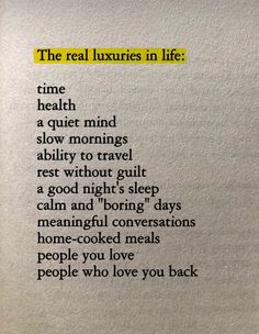 the real luxury in life poem written on a piece of white paper with black writing