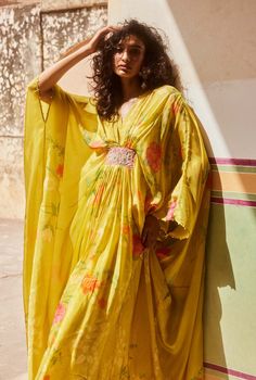 Introducing the lime yellow kaftan set, crafted from placement printed pure habutai silk fabric, where the print is meticulously placed to enhance the extraordinary look of this modern silhouette. Adorned with hand-embroidered patches and delicate details on the sleeves and neck, this silhouette offers a relaxed and super comfy look, perfect for embracing both style and comfort. Yellow Kaftan, Kaftan Set, Printed Kaftan, Kaftan Dresses, Lime Yellow, Earth Goddess, Yellow Print, Kaftan Dress, Delicate Details