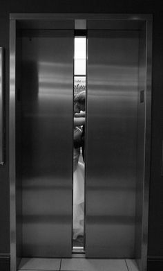 two stainless steel doors open in an office building