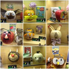 many different stuffed animals and pumpkins on display