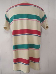 "Vintage 1980s or 90s color block striped cotton polo shirt. Made in the U.S.A. by Polo Ralph Lauren. Has embroidered Polo horse and jockey on chest. Size medium. Actual measurements are: 43\" at the chest 42\" at the waist 18.5\" shoulder seam to shoulder seam 31\" overall length In very good condition." Striped Collared Cotton T-shirt, Casual Multicolor Polo Shirt With Striped Collar, Cotton Polo Shirt With Vertical Stripes, Cotton Short Sleeve Polo Shirt With Vertical Stripes, Retro Short Sleeve Cotton Polo Shirt, Summer Cotton Polo Shirt With Vertical Stripes, Vintage Green Cotton Polo Shirt, Cotton Polo Shirt With Vertical Stripes For Summer, Multicolor Cotton Polo Shirt With Striped Collar