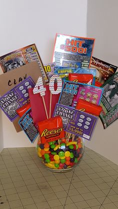 a glass bowl filled with candy on top of a table