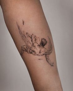 a woman's leg with a tattoo on it that has flowers in the middle