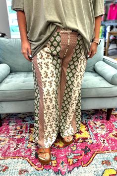 Unleash your inner babe with the NAOMI Wide Leg Pants in Olive. These flowy pants are perfect for these transitional days, with a light weight design that keeps you cool and comfortable. The pattern adds a touch of whimsy to your wardrobe. Step into these stylish pants and let your free-spirited energy shine! Model is wearing a small and 2X. Material: 100% Rayon Sizing: Small: 2/4 Medium: 6/8 Large: 10/12 Casual Boho Print Pants For Spring, Summer Printed Loungewear Pants, Summer Printed Pants For Loungewear, Patterned Wide Leg Beach Bottoms, Flowy Casual Bottoms With Boho Print, Green Bohemian Bottoms With Floral Print, Flowy Boho Print Bottoms For Vacation, Flowy Boho Print Bottoms For Spring, Green Bohemian Floral Print Bottoms