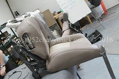 an office chair is being worked on in a factory