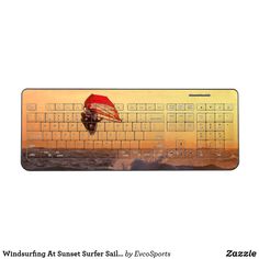 a computer keyboard with an image of a parachute in the sky on it's side