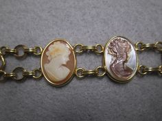 "Such an exquisite cameo bracelet! This one is rather rare, 6 beautiful genuine hand carved cameos are the focal point of this stunning piece. It is vintage 50's/60's Van Dell, new old stock, in excellent vintage condition. Well made in 12kt. gold filled to last for many years to come! It is 7 1/4\" long and 3/4\" wide. A double locking alligator clasp for security. Six different genuine shell cameos interlocking with polished gold, just gorgeous. Of course it is hallmarked Van Dell, and 12kgf." Collectible Vintage Bracelets, Vintage Collectible Bracelets, Vintage Gold Collectible Bracelets, Victorian Gold Bracelets With Cabochon, Collectible Costume Jewelry Bracelets In Yellow Gold, Antique Gold Cabochon Bracelets, Collectible Gold Jubilee Bracelet, Vintage Yellow Gold Cabochon Bracelets, Vintage Gold Bracelets As Collectibles