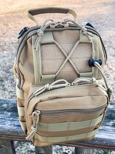 a backpack sitting on top of a wooden bench