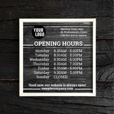 an open hours sign hanging on the side of a wooden wall