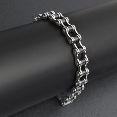 Looking for a unique and stylish bracelet that shows off your love of biking? Then the Stainless Steel and Black Bike Chain Bracelet is the perfect accessory for you! This bracelet features a bike chain design with black accents and a snap lock clasp. Ideal for retailers catering to men and women with an appreciation for both style and durability, this bracelet is a versatile addition that will quickly become a customer favorite. The Wholesale Stainless Steel And Black Bike Chain Bracelets are m Bike Chain Bracelet, Biker Jewelry, Black Bike, Snap Lock, Bike Chain, Jewelry Website, Chain Bracelets, Stylish Bracelet, Motorcycle Women