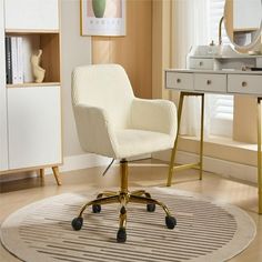 a white chair sitting on top of a rug in front of a desk with a mirror