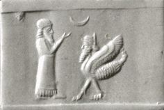 an egyptian relief depicting two birds and a woman