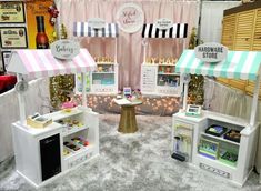 an assortment of toy kitchen appliances on display at a trade show in a retail store