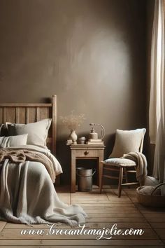 a bed sitting in a bedroom next to a wooden table and chair on top of a hard wood floor