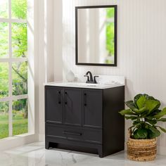 Modernize your bathroom with the Meera 36-in black bathroom vanity cabinet. This skinny Shaker bathroom vanity cabinet features a dark matte black finish that's accented by black decorative hardware for added style. Designed to maximize bathroom storage, this vanity includes a soft-close, full-extension base drawer with 2 compartments and a soft-close 1-door side cabinet with a fixed interior shelf. It also includes a soft-close 2-door under-sink cabinet for easy access to your plumbing and addi Black Restroom Cabinets, Bathroom With Dark Vanity, Bathroom With Black Cabinets, Black Bathroom Vanity, Restroom Cabinets, Washroom Cabinet, Goth Bathroom, Shaker Bathroom Vanity, Under Sink Cabinet