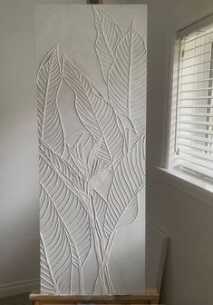 a painting is being made with white paper