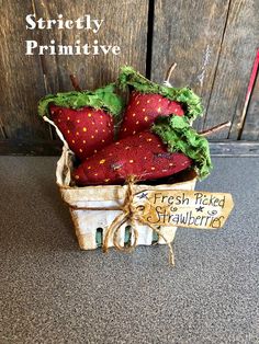 fresh picked strawberries in a wooden crate