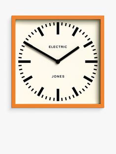 an orange and white clock with the words electric jones written on it's face