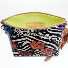 This colorful crossbody bag is ready to take on the day with an adjustable strap and two interior pockets. Crafted with a roomy open interior, the Downtown Crossbody can carry the essentials and more. Carla ConsuelaCloth™ exterior Zipper closure Interior slide pocket and credit card slots Includes detachable and adjustable woven crossbody strap Trimmed in natural, untreated leather 11” (W) x 9 ¼” (H) x 3” (D), 14 ½”-27” adjustable crossbody strap drop Made in Mexico Pattern placement may vary Multicolor Shoulder Bag Pouch For Everyday Use, Multicolor Crossbody Pouch For Everyday Use, Multicolor Everyday Shoulder Bag With Zipper Pouch, Multicolor Leather Bags, Multicolor Crossbody Travel Pouch, Multicolor Shoulder Bag With Zipper Pouch, Multicolor Leather Bag With Zipper Pouch, Multicolor Clutch Bag With Adjustable Strap, Multicolor Crossbody Shoulder Bag With Zipper Pouch