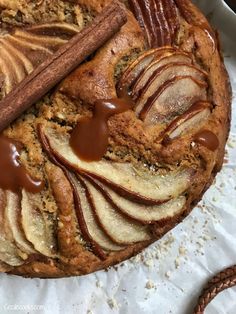 a cake with apples and cinnamon on top