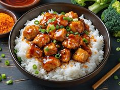 a brown bowl filled with rice and meat covered in sauce next to broccoli