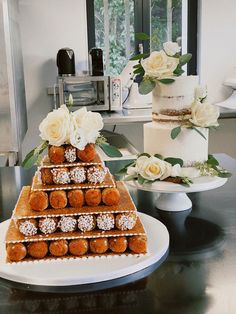 there are many desserts on the table and one is decorated with flowers in it