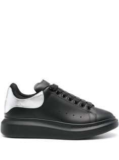 black/silver-tone calf leather round toe side perforated detailing logo-print tongue metallic contrasting branded heel counter padded ankle branded leather insole flat rubber sole front lace-up fastening To lessen the environmental impact and to reduce cotton consumption, Alexander McQueen will no longer be providing a dust bag with its sneakers. We've partnered with Good On You — an independent agency that rates how brands perform in relation to their impact on the planet, people and animals, with a multi-criteria rating simplified to a five points scale. In order to be awarded our conscious label, larger brands need to score a minimum of four out of five ('Good'), while smaller brands must score at least three out of five ('It's A Start'). This item comes from a brand rated three out of Silver Lace-up Sneakers With Textured Sole, Silver Low-top Sneakers With Textured Sole, Modern Metallic Sneakers With Rubber Sole, Metallic Sneakers With Perforated Toe Box, Silver Leather Sneakers With Contrast Sole, Silver Low-top Sneakers With Contrast Sole, Metallic Sneakers With Perforations And Round Toe, Metallic Sneakers With Perforations, Silver Sneakers With Textured Sole And Round Toe