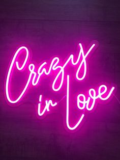 a neon sign that says crazy in love