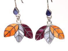 "// Multi-Gemstone Leaf Inlay Earrings // Includes genuine gemstones! // These beautiful inlay earrings have been handcrafted in Peru. The craftsmanship is amazing! The metal is made of solid .950 sterling silver, which means it is a higher purity than standard .925 sterling silver.  The gemstones included are: Spiny Oyster (in purple and orange) and Mother of Pearl We only have one pair of these-- you will receive the exact item in the photos! Each earrings has a total length of 1 3/4\", which Multicolor Leaf Shaped Jewelry For Gifts, Multicolor Leaf-shaped Jewelry Gift, Handmade Multicolor Leaf-shaped Jewelry, Spiny Oyster, Leaf Earrings, Orange And Purple, Sterling Silber, Mother Of Pearl, Peru