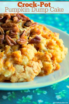 crock - pot pumpkin dump cake on a plate with pecans in the middle